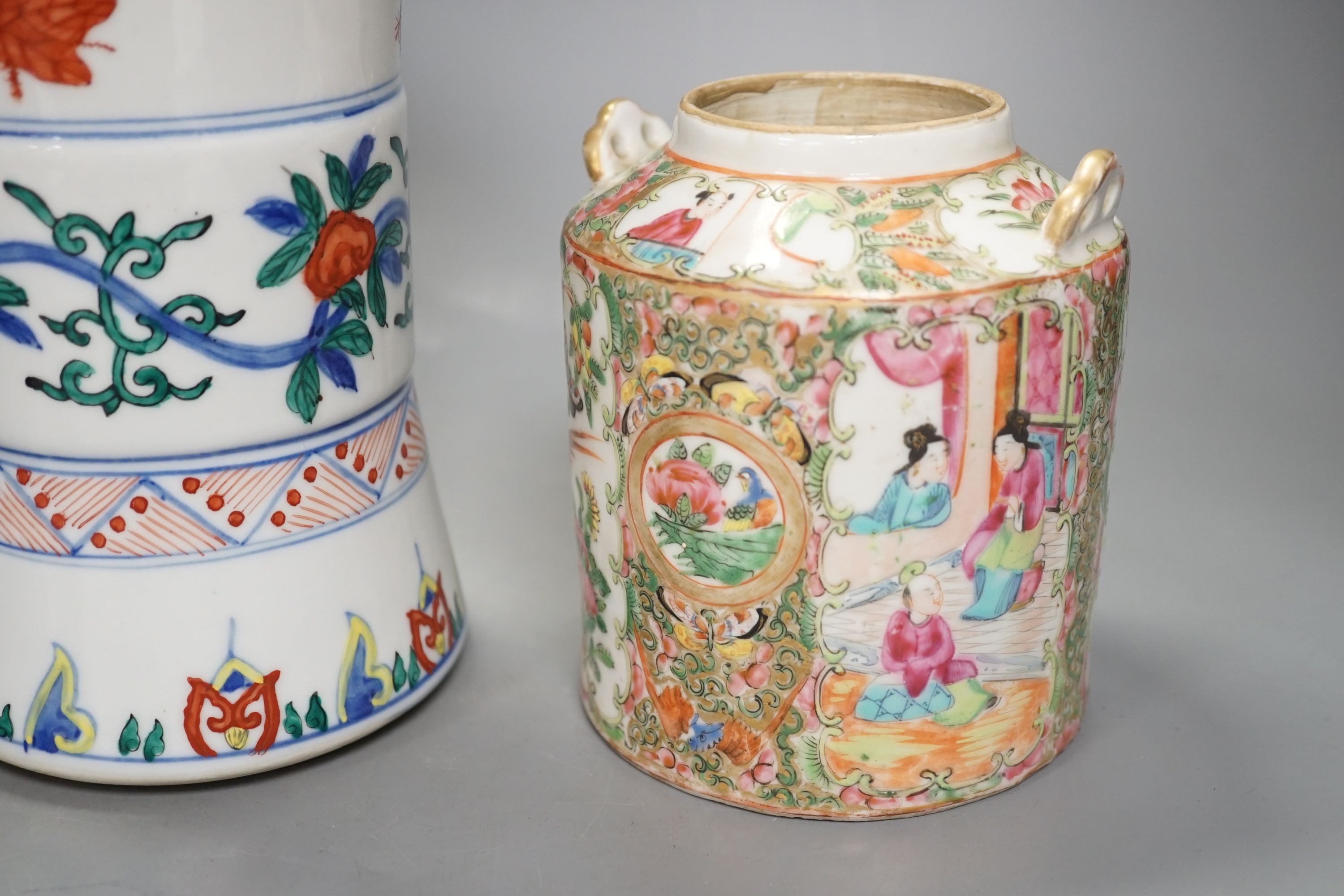 A Chinese prunus jar and cover, a polychrome vase and a famille rose jar, 24cms high.